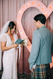 Bride reads her vows at the sure thing chapel. Groom stands at the altar at the sure thing chapel waiting for his bride. Captured by las vegas elopement photographer brazen honey films