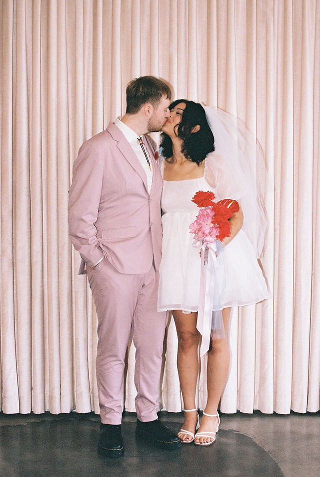 Las vegas elopement film photographer captures weddings on 35mm film. Vegas kitsch wedding vibes at the sure thing chapel. Analog photobooth in downtown las vegas.