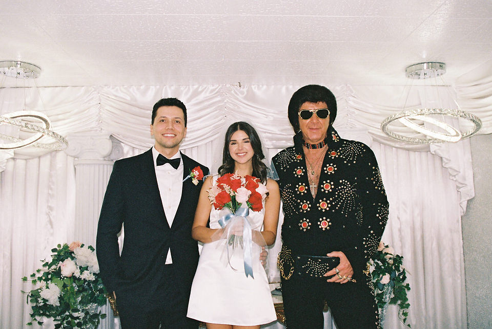 Las Vegas elopement film photographer brazen honey captures vintage inspired elopement at the little white wedding chapel. Wedding photos captured on 35mm film in downtown vegas under the neon lights.