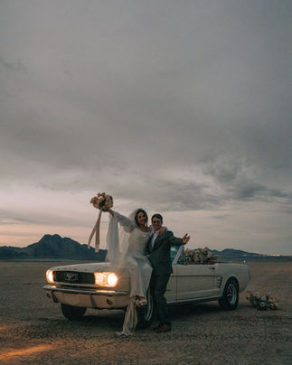 las vegas wedding photographer. Jean dry lake bed intimate elopement. Vintage convertible mustang wedding car floral installation. 
