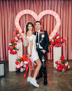 Las Vegas wedding photographer brazen honey films captures an epic elopement at sure thing chapel with elvis officiant. Photoshoot at the neon museum and downtown las vegas with neon lights.