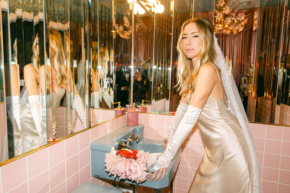 california couple gets married at sure thing chapel in las vegas, captured by film wedding photographer brazen honey films. Blue vintage cutrains and pink heart altar give this kitschy wedding chapel all the vintage vibes.