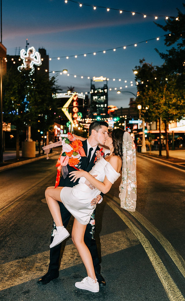 Las Vegas wedding photographer brazen honey films captures an epic elopement at sure thing chapel with elvis officiant. Photoshoot at the neon museum and downtown las vegas with neon lights.