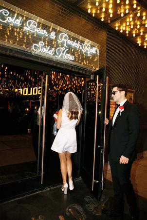 Las Vegas elopement film photographer brazen honey captures vintage inspired elopement at the little white wedding chapel. Wedding photos captured on 35mm film in downtown vegas under the neon lights.