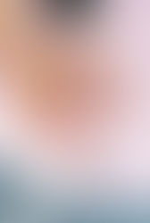 photo of hands wearing wedding rings resting on a pink cadillac hood