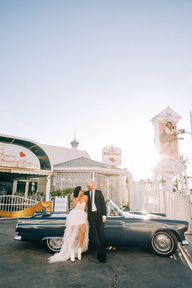 Couple celebrates their wedding outside the little white wedding chapel on fremont street. captured by las vegas elopement photographer brazen honey films