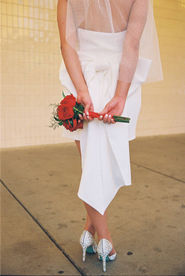 Kitsch elopement at the little white wedding chapel in las vegas shot on 35mm film. Neon lights wedding portraits by wedding photographers brazen honey films