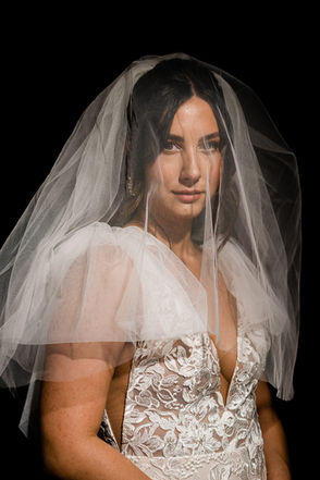 Studio portrait of bride wearing veil against black backdrop. Shot by las vegas wedding photographer brazen honey films