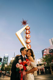 Las Vegas wedding photographer brazen honey films captures an epic elopement at sure thing chapel with elvis officiant. Photoshoot at the neon museum and downtown las vegas with neon lights. 