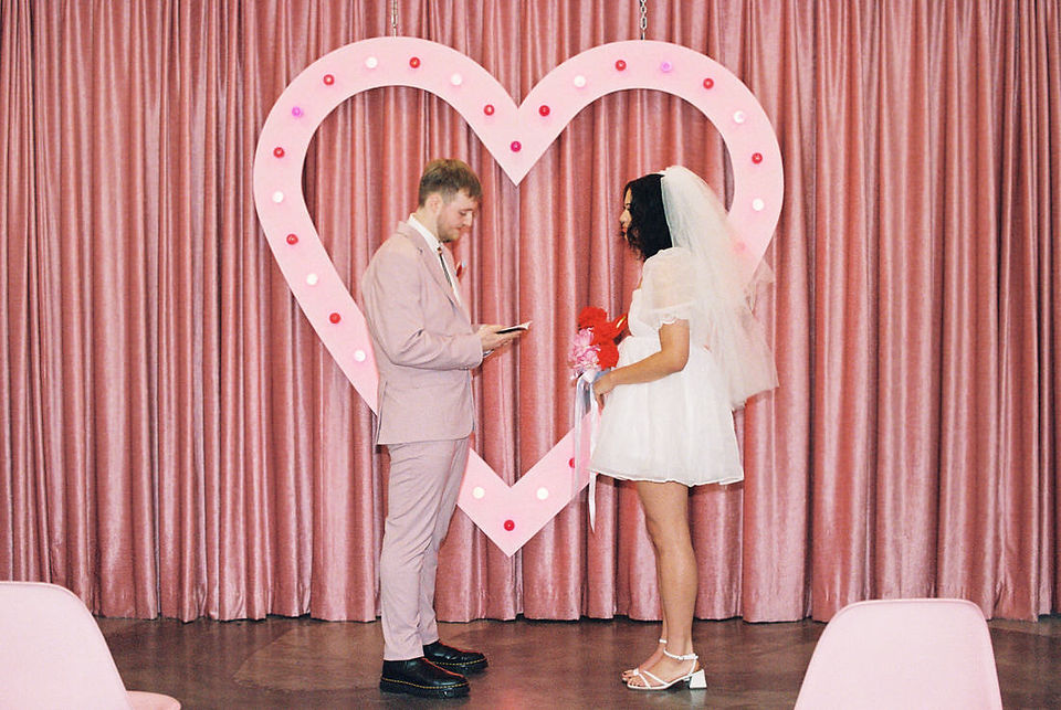 Las vegas elopement film photographer captures weddings on 35mm film. Vegas kitsch wedding vibes at the sure thing chapel. Analog photobooth in downtown las vegas.