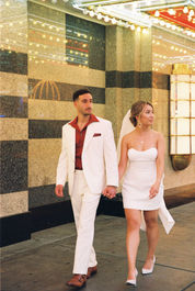 Kitsch elopement at the little white wedding chapel in las vegas shot on 35mm film. Neon lights wedding portraits by wedding photographers brazen honey films