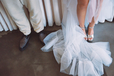 35mm film photo by las vegas elopement photographer brazen honey films. couple gets married at sure thing chapel with pink vintage vibes.
