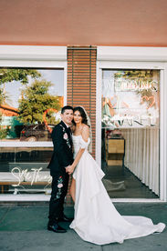 Las Vegas wedding photographer brazen honey films captures an epic elopement at sure thing chapel with elvis officiant. Photoshoot at the neon museum and downtown las vegas with neon lights.