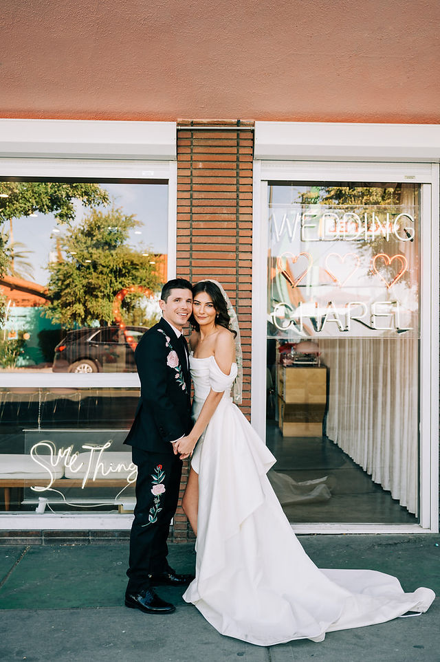 Las Vegas wedding photographer brazen honey films captures an epic elopement at sure thing chapel with elvis officiant. Photoshoot at the neon museum and downtown las vegas with neon lights.