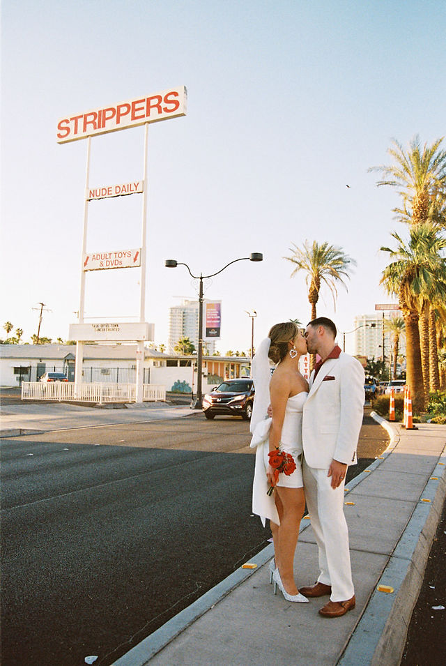 Kitsch elopement at the little white wedding chapel in las vegas shot on 35mm film. Neon lights wedding portraits by wedding photographers brazen honey films