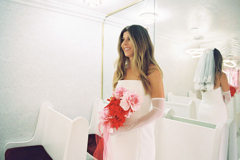 Las Vegas Vow Renewal at the Little White wedding chapel captured on 35mm film by elopement photographers brazen honey films. Tunnel of love elopement photos