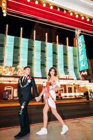 Las Vegas wedding photographer brazen honey films captures an epic elopement at sure thing chapel with elvis officiant. Photoshoot at the neon museum and downtown las vegas with neon lights.