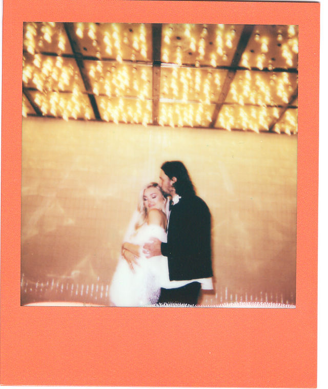 Las Vegas elopement photographer captures vibrant wedding at the little white wedding chapel. Polaroid wedding photos