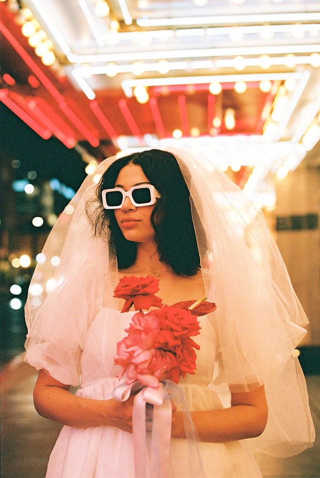 Las vegas elopement film photographer captures weddings on 35mm film. Vegas kitsch wedding vibes at the sure thing chapel. Analog photobooth in downtown las vegas.