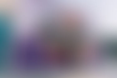 Bride and groom kiss in front of Las Vegas postcard mural in the arts district. Where to take wedding pictures in Las Vegas. Captured by las Vegas elopement photographer brazen honey films.