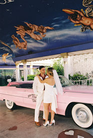 Kitsch elopement at the little white wedding chapel in las vegas shot on 35mm film. Neon lights wedding portraits by wedding photographers brazen honey films