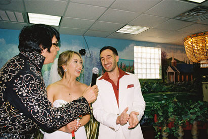 Kitsch elopement at the little white wedding chapel in las vegas shot on 35mm film. Neon lights wedding portraits by wedding photographers brazen honey films