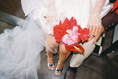 35mm film photo by las vegas elopement photographer brazen honey films. couple gets married at sure thing chapel with pink vintage vibes.