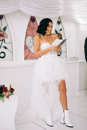 bride and groom recite wedding vows at the little white wedding chapel in las vegas. elvis wedding officiant captured by las vegas elopement photographer brazen honey films