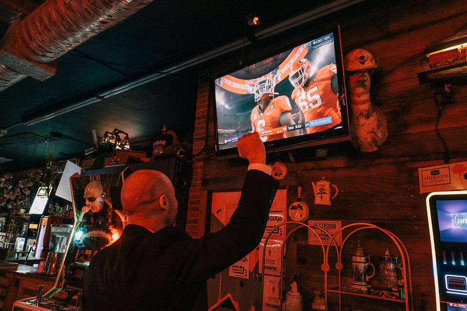 bride and groom pose for photos at a dive bar in las vegas captured by las vegas elopement photographer brazen honey films