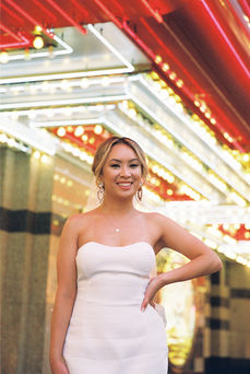 Kitsch elopement at the little white wedding chapel in las vegas shot on 35mm film. Neon lights wedding portraits by wedding photographers brazen honey films