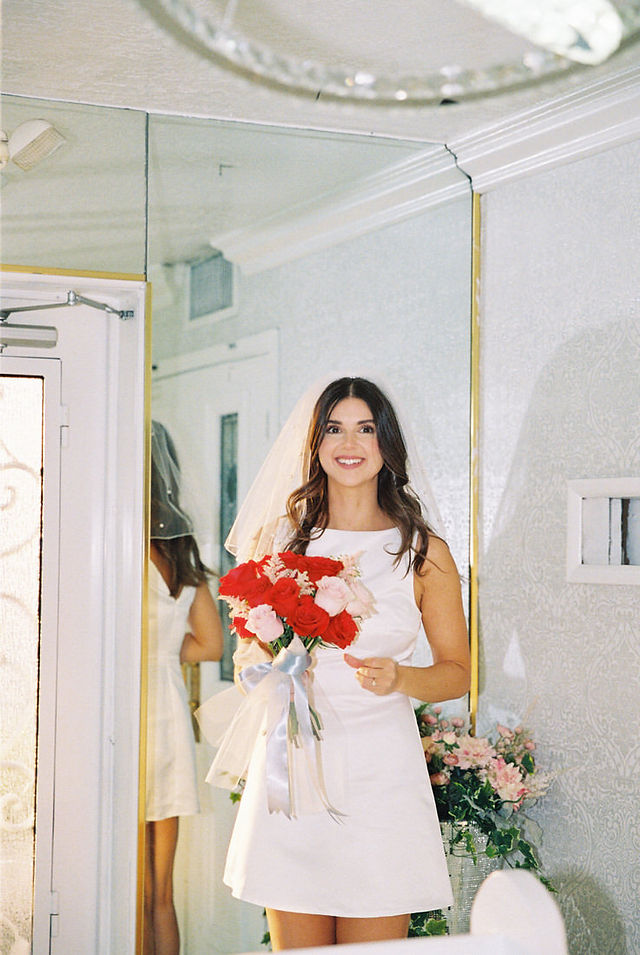 Las Vegas elopement film photographer brazen honey captures vintage inspired elopement at the little white wedding chapel. Wedding photos captured on 35mm film in downtown vegas under the neon lights.