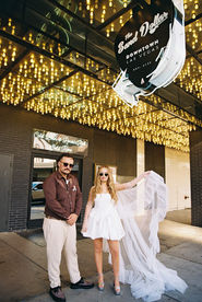 35mm film photo by las vegas elopement photographer brazen honey films. couple takes pictures in downtown las vegas with neon lights and vintage vibes.