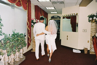 Kitsch elopement at the little white wedding chapel in las vegas shot on 35mm film. Neon lights wedding portraits by wedding photographers brazen honey films