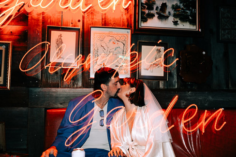 las vegas elopement photographer brazen honey films captures wedding at little white chapel with elvis officiant. Colorful wedding photos in downtown las vegas with neon lights 