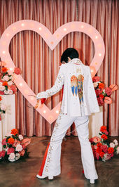 Las Vegas wedding photographer brazen honey films captures an epic elopement at sure thing chapel with elvis officiant. Photoshoot at the neon museum and downtown las vegas with neon lights.