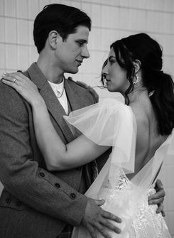 Bride and groom take wedding portraits in downtown las vegas under the neon lights. Captured by las vegas elopement photographer brazen honey films