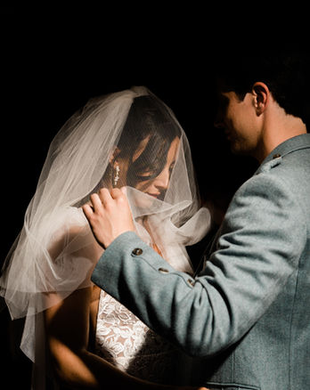 Studio portrait of bride and groom against black backdrop. Shot by las vegas wedding photographer brazen honey films