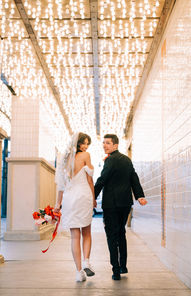 Las Vegas wedding photographer brazen honey films captures an epic elopement at sure thing chapel with elvis officiant. Photoshoot at the neon museum and downtown las vegas with neon lights. 