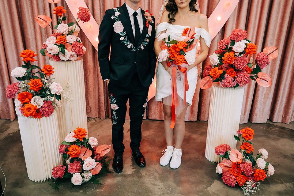 Las Vegas wedding photographer brazen honey films captures an epic elopement at sure thing chapel with elvis officiant. Photoshoot at the neon museum and downtown las vegas with neon lights.