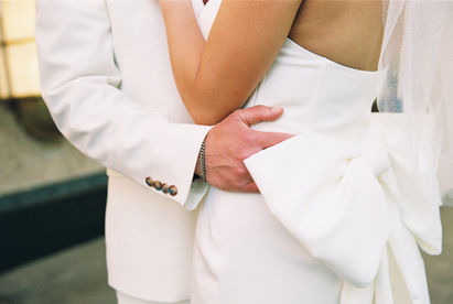 Kitsch elopement at the little white wedding chapel in las vegas shot on 35mm film. Neon lights wedding portraits by wedding photographers brazen honey films