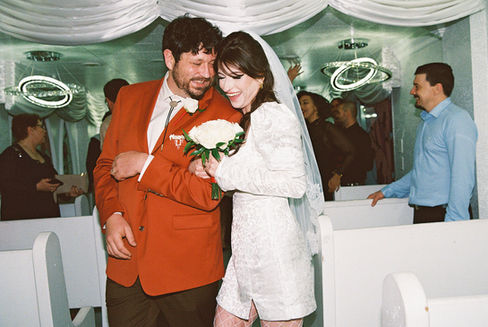 35mm film photograph of the little white wedding chapel at night by las vegas elopement photographer brazen honey films