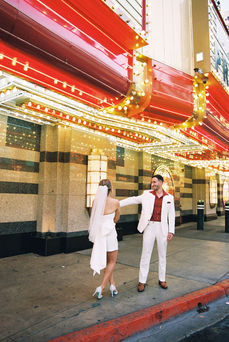 Kitsch elopement at the little white wedding chapel in las vegas shot on 35mm film. Neon lights wedding portraits by wedding photographers brazen honey films