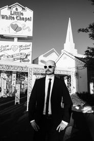 Couple celebrates their wedding outside the little white wedding chapel on fremont street. captured by las vegas elopement photographer brazen honey films