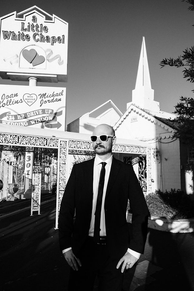 Couple celebrates their wedding outside the little white wedding chapel on fremont street. captured by las vegas elopement photographer brazen honey films