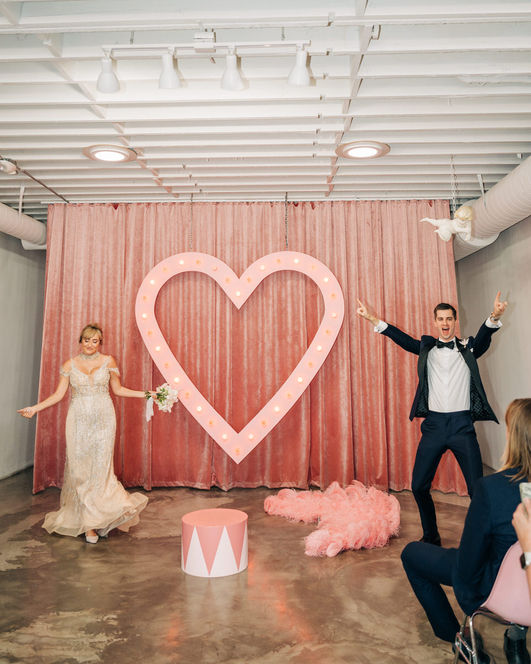 Bride and groom enter their wedding ceremony at the sure thing chapel on fremont street. captured by las vegas elopement photographer brazen honey films