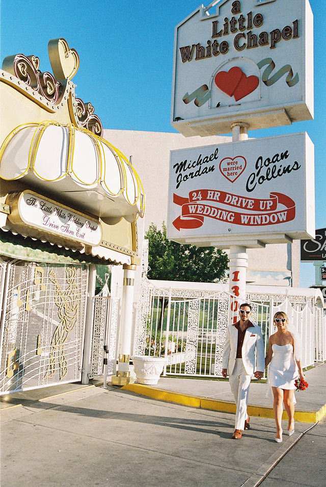 Kitsch elopement at the little white wedding chapel in las vegas shot on 35mm film. Neon lights wedding portraits by wedding photographers brazen honey films