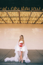 35mm film photo by las vegas elopement photographer brazen honey films. couple takes pictures in downtown las vegas with neon lights and vintage vibes.