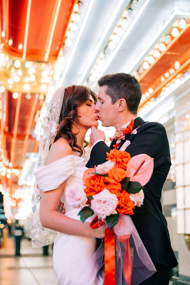 Las Vegas wedding photographer brazen honey films captures an epic elopement at sure thing chapel with elvis officiant. Photoshoot at the neon museum and downtown las vegas with neon lights.