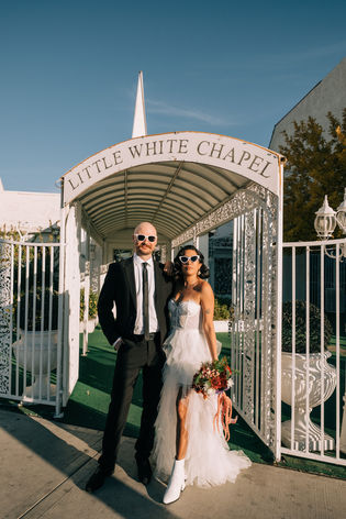 bride and groom recite wedding vows at the little white wedding chapel in las vegas. elvis wedding officiant captured by las vegas elopement photographer brazen honey films