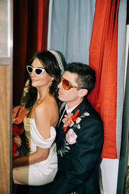 Las Vegas wedding photographer brazen honey films captures an epic elopement at sure thing chapel with elvis officiant. Photoshoot at the neon museum and downtown las vegas with neon lights.